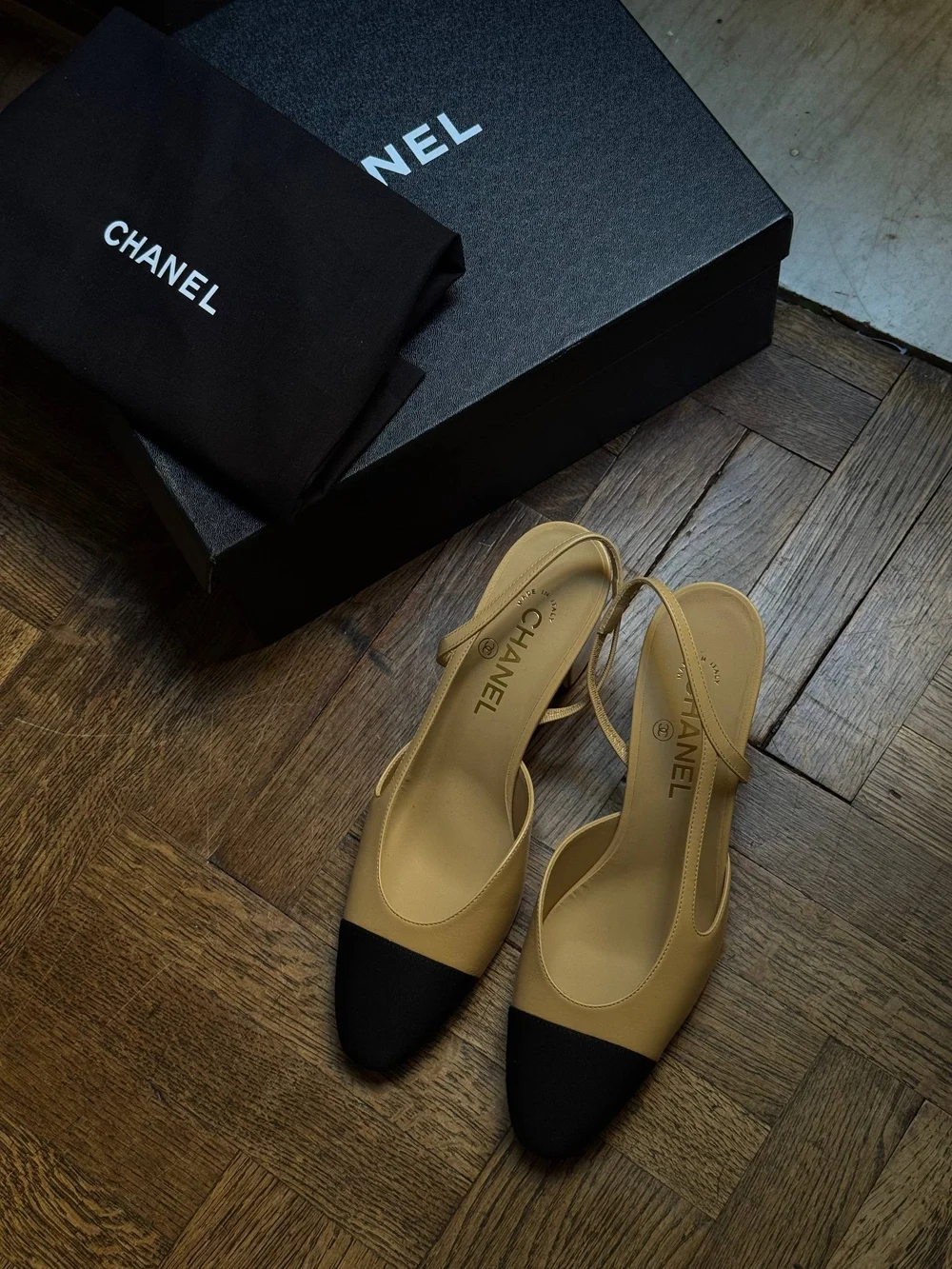CHANEL Beige Slingback Pumps with Black Cap Toe